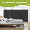 A bedroom scene with a bed and a room divider. Anteprima dell’immagine prodotto