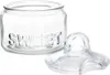 A clear glass jar with the word "SWEET" embossed on it, and its lid is placed next to it. Náhled obrázku produktu
