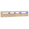 A long, low TV stand with three open compartments, each illuminated by blue LED lights. Náhled obrázku produktu