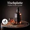 A bottle of whiskey and a glass of whiskey sit on a wooden barrel. Náhled obrázku produktu