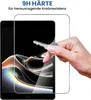 A hand holding a key near a tablet screen protector. Produktbild-Vorschau