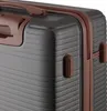 A close-up view of a dark gray suitcase with brown accents. Náhled obrázku produktu
