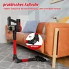 A cordless vacuum cleaner is shown in a living room setting, demonstrating its ability to bend and reach under a sofa. A close-up inset shows the bending mechanism. Produktbild-Vorschau