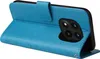 A blue flip phone case with floral and butterfly embossed details is shown from a diagonal angle, with the case open to reveal the phone's camera module. Produktbild-Vorschau