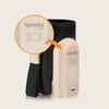A close-up view of a baby bottle warmer with a digital display showing the temperature, next to its protective sleeve. Produktbild-Vorschau