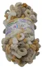 A ball of textured yarn with loops, in various shades of beige, white, and gray. Anteprima dell’immagine prodotto