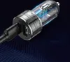 A close-up shot of a car charger with visible internal circuitry. Produktbild-Vorschau