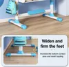 Close-up of the base of a children's study desk, showing its wide and firm feet for stability. Produktbild-Vorschau