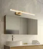 A modern bathroom vanity with a sink, faucet, mirror, and a gold LED light fixture above the mirror. Náhľad obrázku produktu