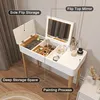 A white vanity table with a mirror and storage compartments, filled with makeup and accessories. Produktbild-Vorschau
