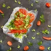 Vacuum-sealed vegetables on a dark textured background. Náhľad obrázku produktu