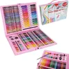 A pink art set case is open, displaying its contents of crayons, markers, and paints. Podgląd zdjęcia produktu