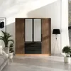 A modern bedroom scene featuring a wardrobe, sofa, and floor lamp. Produktbild-Vorschau