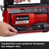 A person's hands are opening a storage compartment on a red and black Einhell cordless compressor. Produktbild-Vorschau