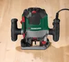 A PARKSIDE router is placed on a wooden surface. Produktbild-Vorschau