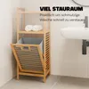 A bamboo laundry basket with shelves in a bathroom setting next to a sink. Podgląd zdjęcia produktu