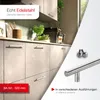 A kitchen scene with cabinets and a coffee machine, featuring stainless steel cabinet handles and a close-up of a handle with screws. Produktbild-Vorschau