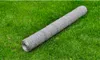 A roll of galvanized steel wire mesh fencing lies on a green grassy lawn. Produktbild-Vorschau