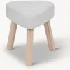 A heart-shaped stool with three wooden legs on a white background. Náhled obrázku produktu