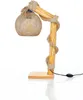 A table lamp with a wooden base and stem, wrapped in rope and burlap, with a spherical lampshade made of twine. Produktbild-Vorschau