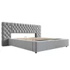 A grey upholstered bed frame with a tufted headboard and integrated reading lights, shown from a side angle against a white background. Náhľad obrázku produktu