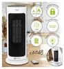 A white and black tower heater is shown on a wooden table with decorative elements in the background. Various feature icons and text are overlaid on the right side of the image. Podgląd zdjęcia produktu