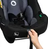 A hand is shown adjusting a strap on a car seat. Podgląd zdjęcia produktu