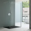 A modern bathroom with a glass-enclosed shower and a freestanding bathtub visible through the window. Produktbild-Vorschau