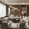 A luxurious living room with a sectional sofa, armchairs, and a coffee table. Anteprima dell’immagine prodotto