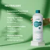 A hand holding a bottle of HAKA Neutralseife Liquid Pur against a green background with text describing its features. Produktbild-Vorschau
