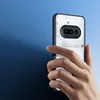 A hand holding a transparent phone case with a black frame, revealing the phone's internal components. Produktbild-Vorschau