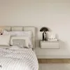 A bedroom scene with a bed and a nightstand. Anteprima dell’immagine prodotto