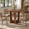 A dining table with chairs set in a room with a fireplace and window. Voir les images du produit