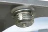 A close-up view of a metal screw mechanism attached to a gray surface. Produktbild-Vorschau