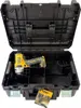An open black tool case with a yellow and black DeWALT impact wrench inside. A manual is placed at the bottom front of the case. Podgląd zdjęcia produktu