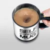 A hand holding a self-stirring mug filled with a brown beverage. Náhled obrázku produktu