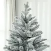 A close-up view of the top section of a flocked artificial Christmas tree. Náhled obrázku produktu