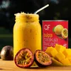 A close-up shot of a passion fruit smoothie in a jar, accompanied by fresh passion fruits, mango chunks, and a can of passion fruit pulp. Anteprima dell’immagine prodotto