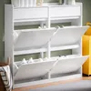 A white shoe cabinet with multiple open compartments, displaying shoes inside. Náhľad obrázku produktu