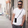 A man wearing a white t-shirt and sunglasses is leaning against a wall outdoors, with a phone attached to a lanyard around his neck. Podgląd zdjęcia produktu