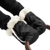 Close-up of black hand warmers with white fluffy lining attached to stroller handles. Anteprima dell’immagine prodotto
