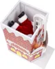A Christmas decoration of Santa Claus stuck in a chimney. Voir les images du produit