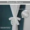 A close-up of a white lace tie-back for a curtain, tied in a bow. Produktbild-Vorschau