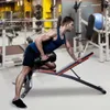 A man is performing a dumbbell row exercise on an adjustable weight bench in a gym. Náhľad obrázku produktu