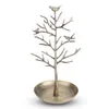 A bronze-colored jewelry stand shaped like a tree with birds perched on its branches, set against a white background. Podgląd zdjęcia produktu