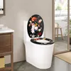 A white toilet with a decorative lid and seat featuring a floral pattern. Produktbild-Vorschau