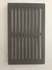 A rectangular metal grate with parallel slots, placed against a plain white background. Voir les images du produit