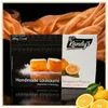 Kandylas Handmade Loukoumi mit Bergamotte-Geschmack Verpackung auf orangefarbenem Stoff Produktbild-Vorschau
