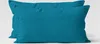 Two teal pillowcases are shown side-by-side against a light gray background. Produktbild-Vorschau