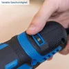 A hand is shown adjusting a speed dial on a black and blue power tool. Produktbild-Vorschau